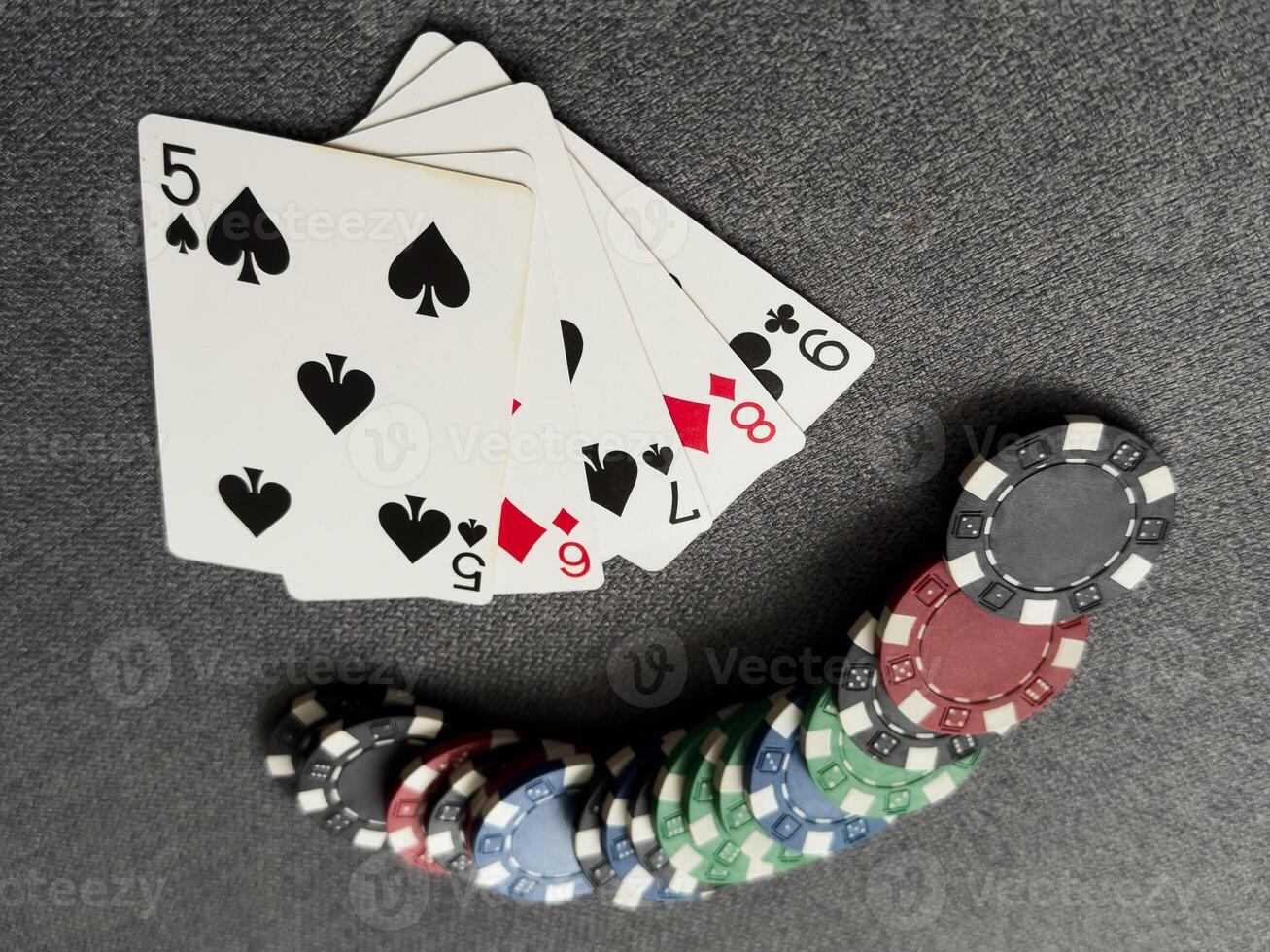 Chips are colored for poker and playing cards on the poker table. poker. casino. win. photo