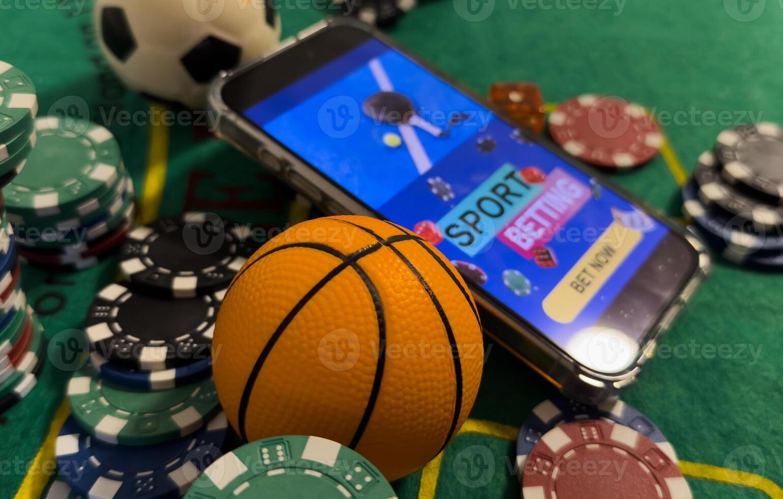 Online poker concept. Smartphone and poker chips on a green background. Poker online banner. Copy space. Vignette. Place for text. Gambling. Background photo