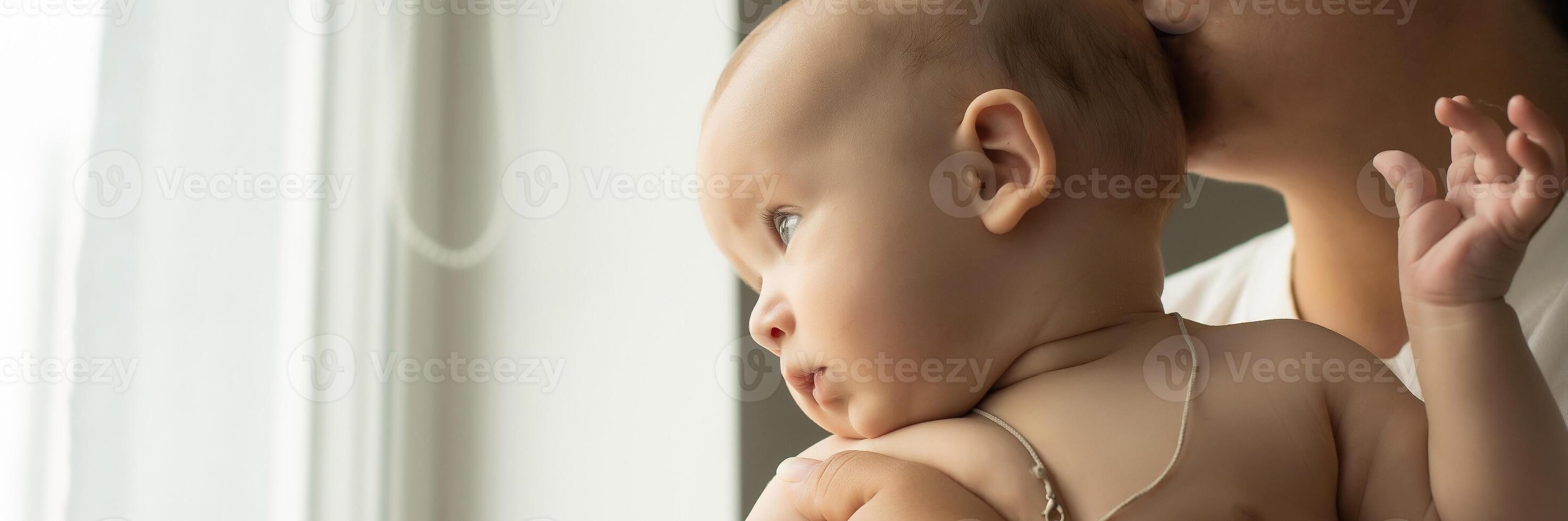 picture of happy mother with baby in hands photo