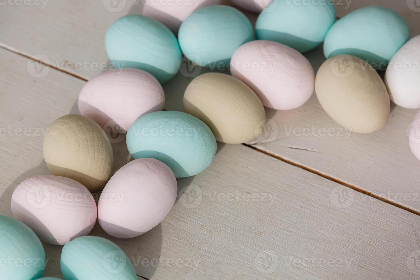 Easter eggs on wooden background photo
