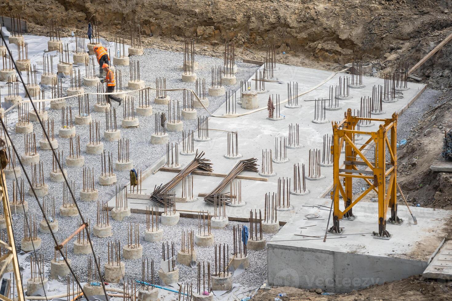 Laborers working on modern constraction site works in Dubai. Fast urban development consept. photo