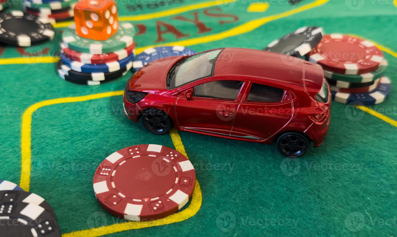 pile of casino chips and toy car, photo