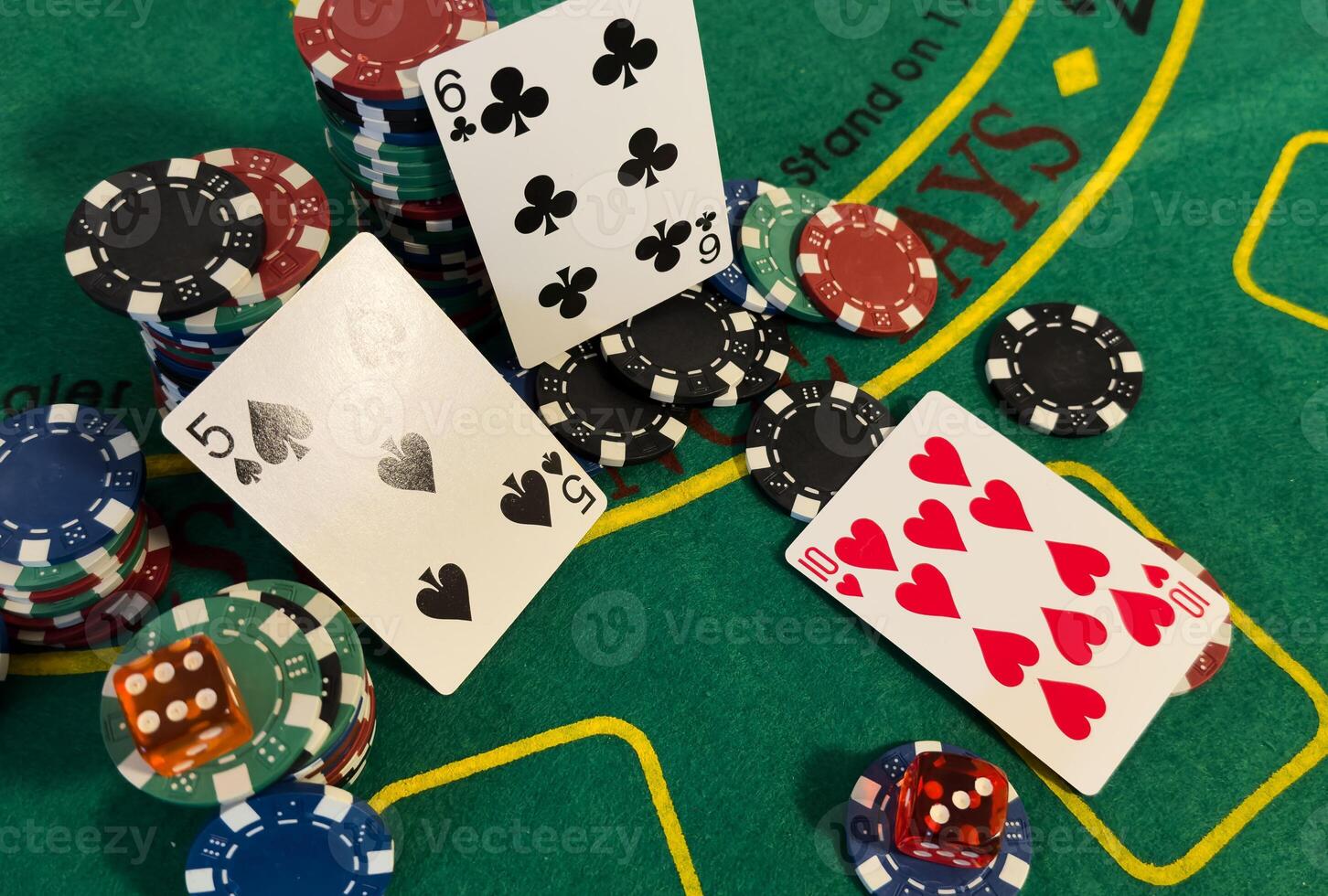 Chips are colored for poker and playing cards on the poker table before the game. poker. casino. win. isolated photo