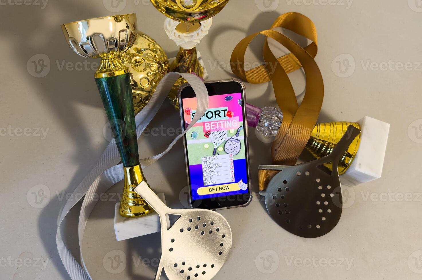 Business and sport concept. Ball and smartphone with bet application photo