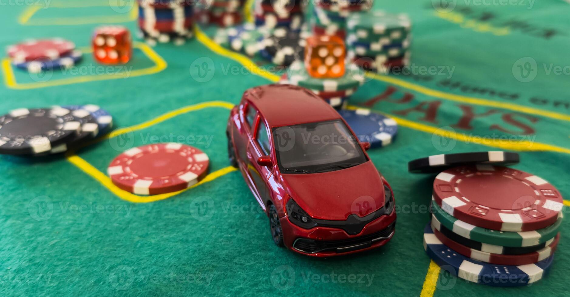 pile of casino chips and toy car, photo