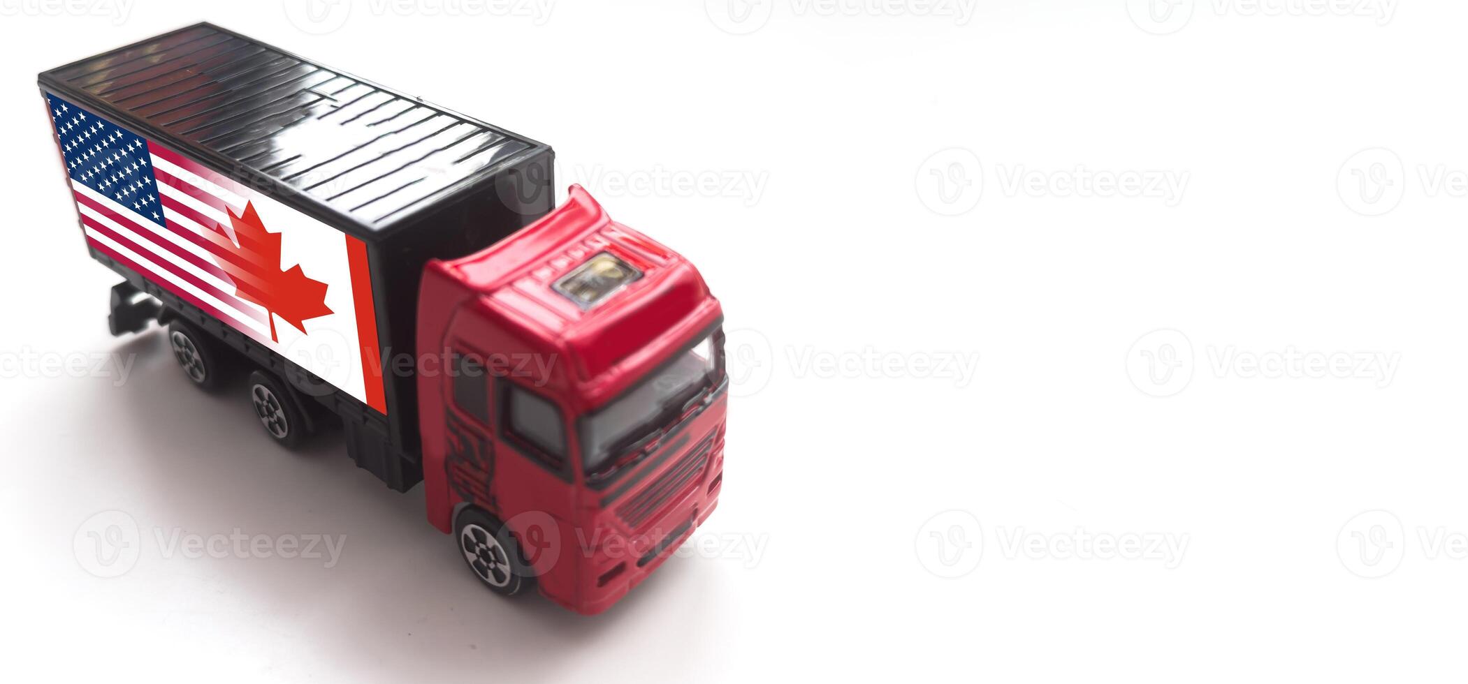 A truck with the national flag of USA depicted on the tailgate drives against a white background. Concept of export-import, transportation, national delivery of goods photo