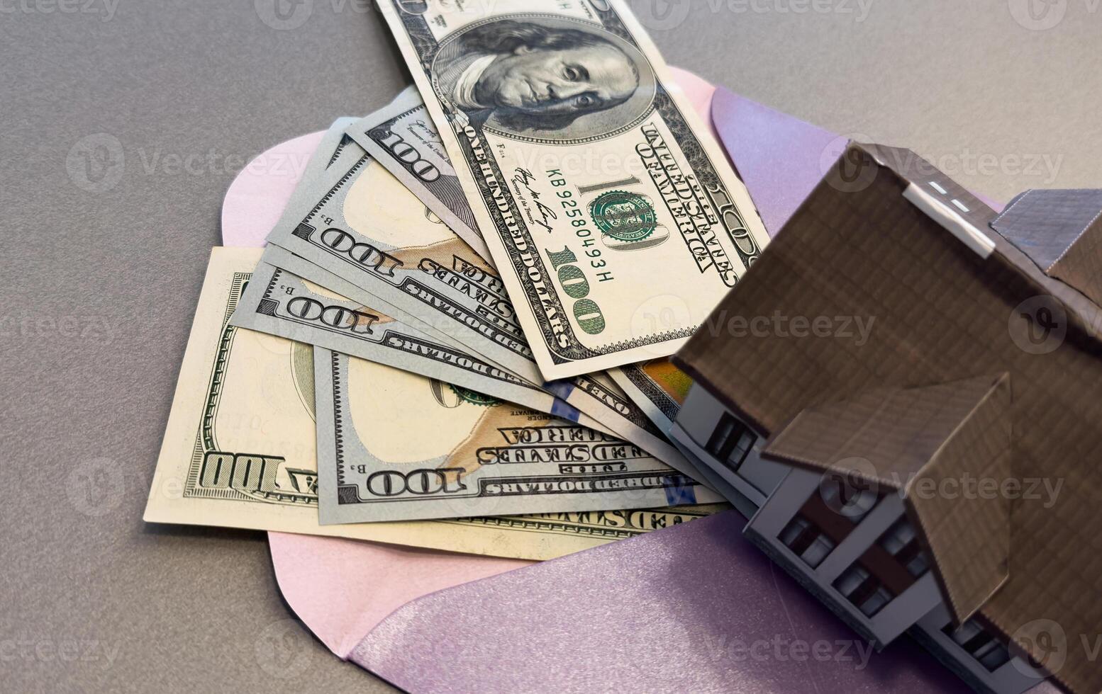 dollars in envelope, house model photo