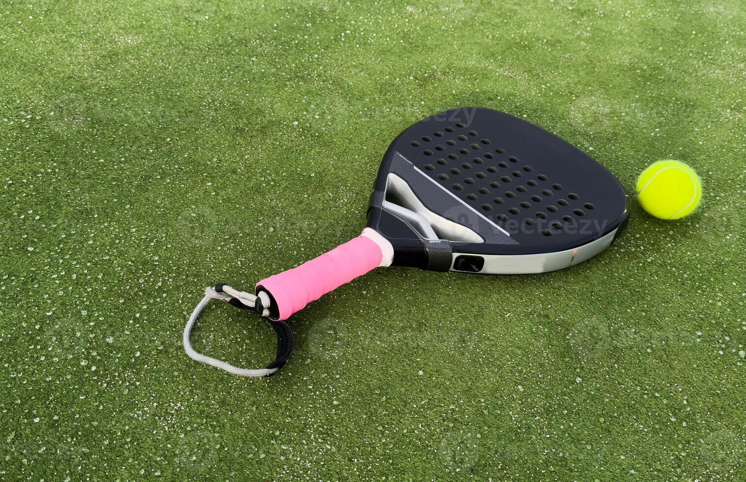 Padel tennis racket sport court and balls. Download a high quality photo with paddle for the design of a sports app or soical media advertisement