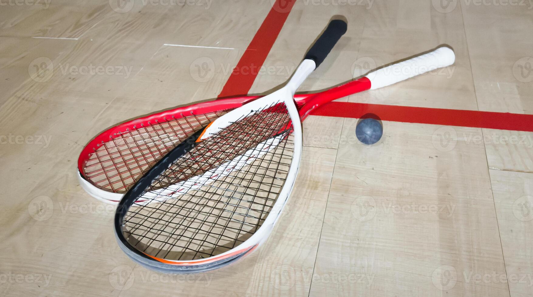Sports, above and racket on squash court for competition, challenge and training center. Exercise, interior and empty room with top view of wooden floor of gymnasium for games, fitness club and gear photo