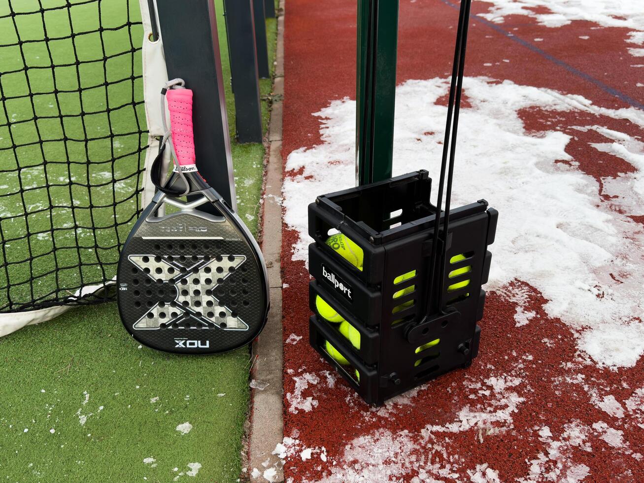 Kyiv, ukraine - january 12, 2025 A tennis padel court covered in the snow, sport cancelled due to inclement weather. paddle racket nox photo