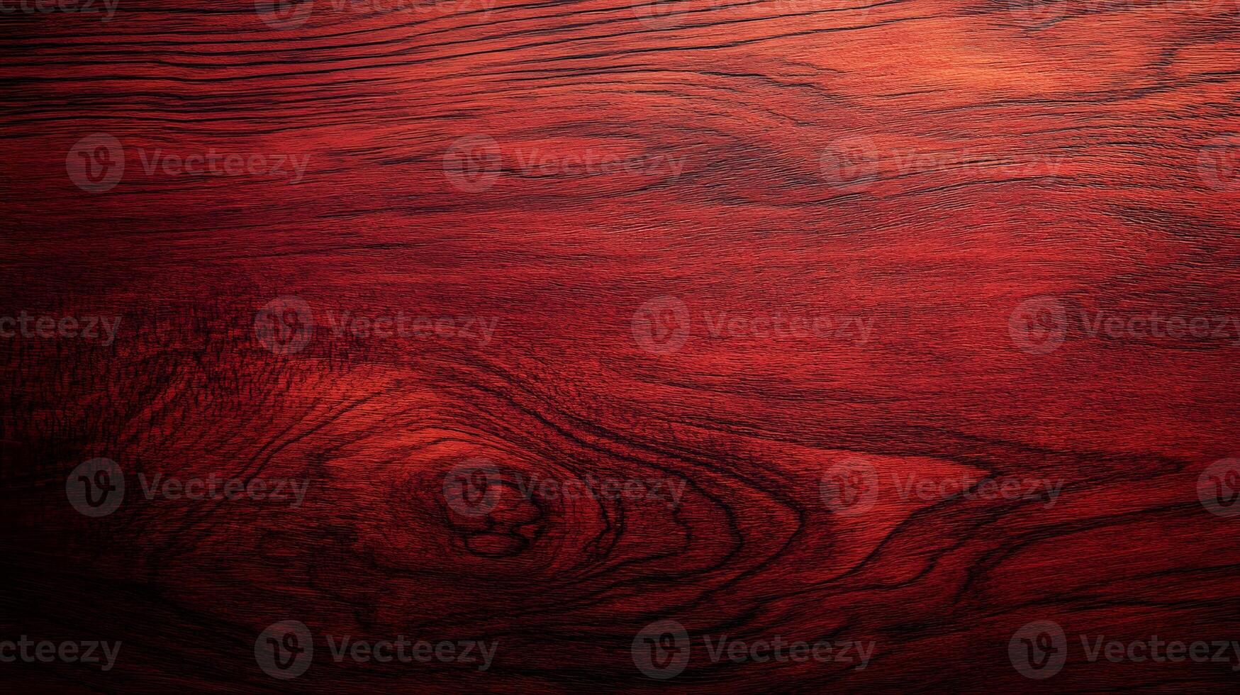 Rich mahogany wood surface showcasing intricate grain patterns and textures in warm lighting photo