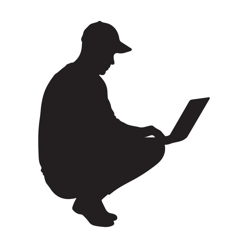 Silhouette of a person crouched down working on a laptop. vector