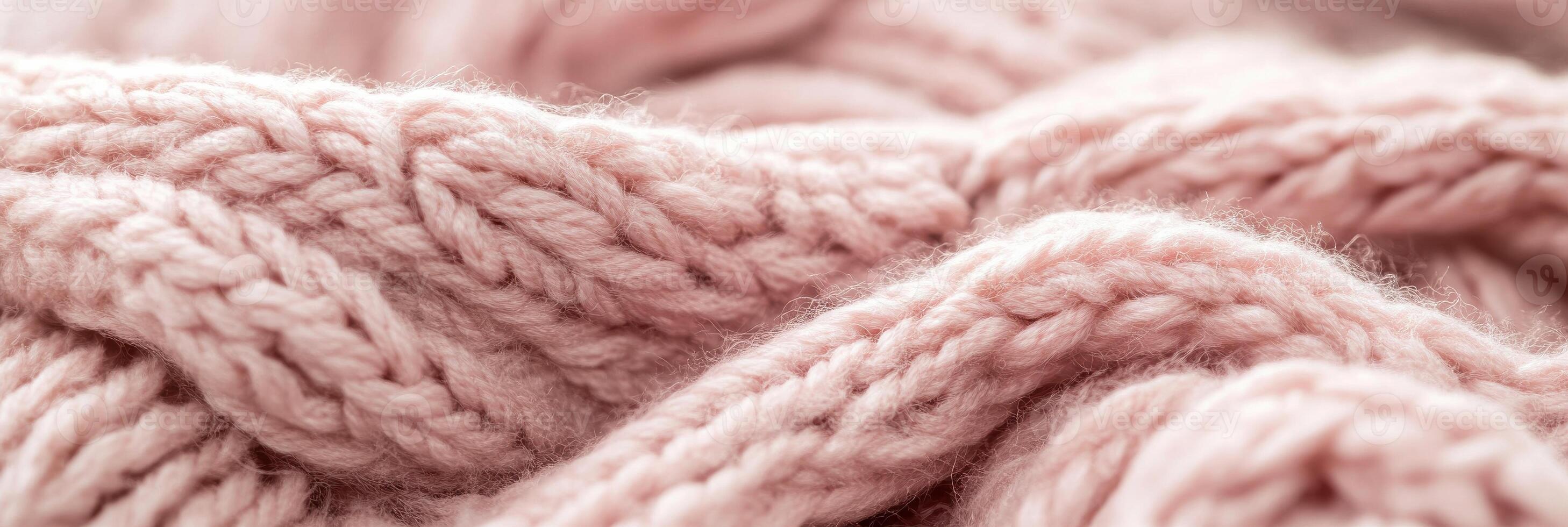Cozy closeup of pink wool texture with intricate patterns in soft focus photo