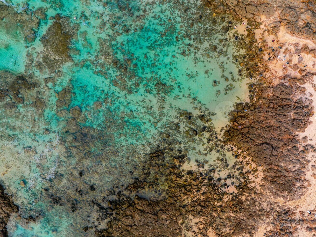 Aerial View of Coastal Waters and Rocky Terrain on Oahu Island, Hawaii photo