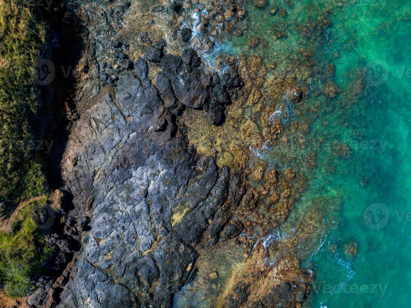 Aerial View of Rugged Coastline with Volcanic Rocks in Oahu, Hawaii photo