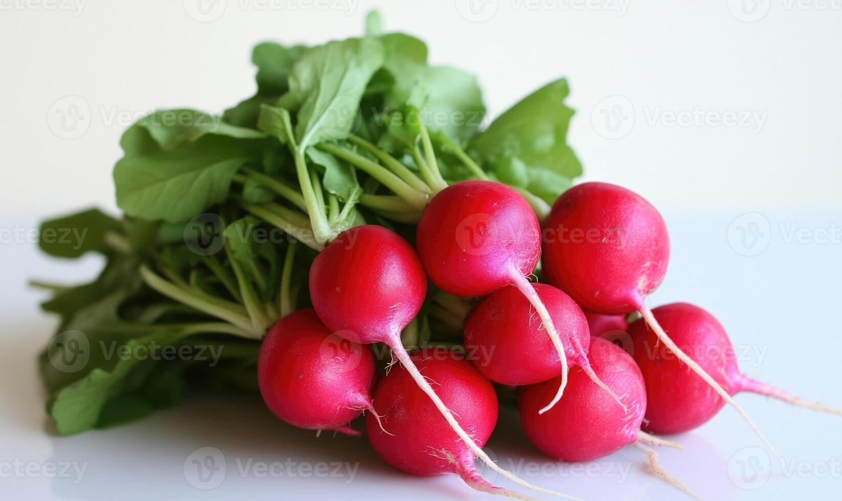 A bunch of radishes are sitting on a white table photo