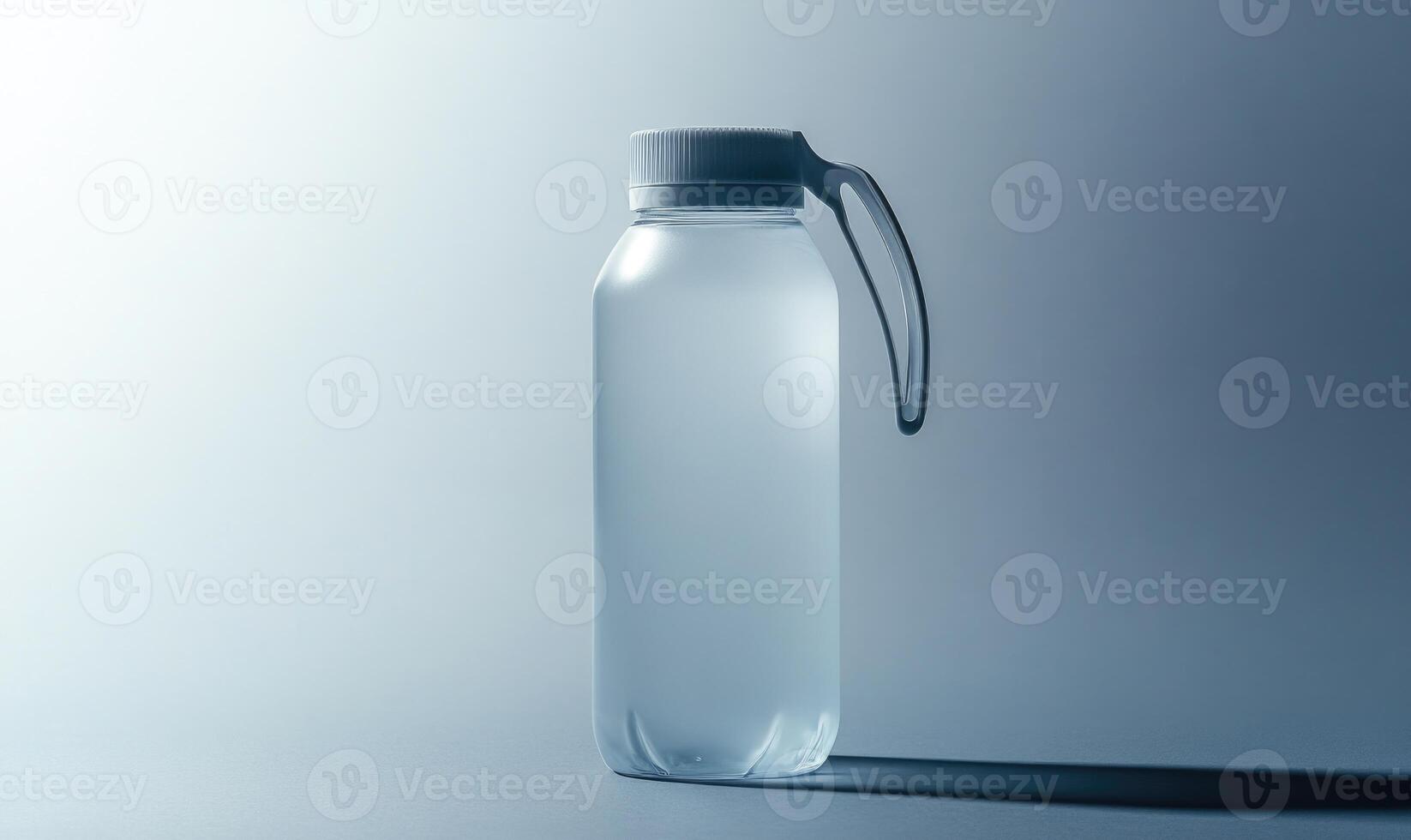 A clear bottle with a white lid photo
