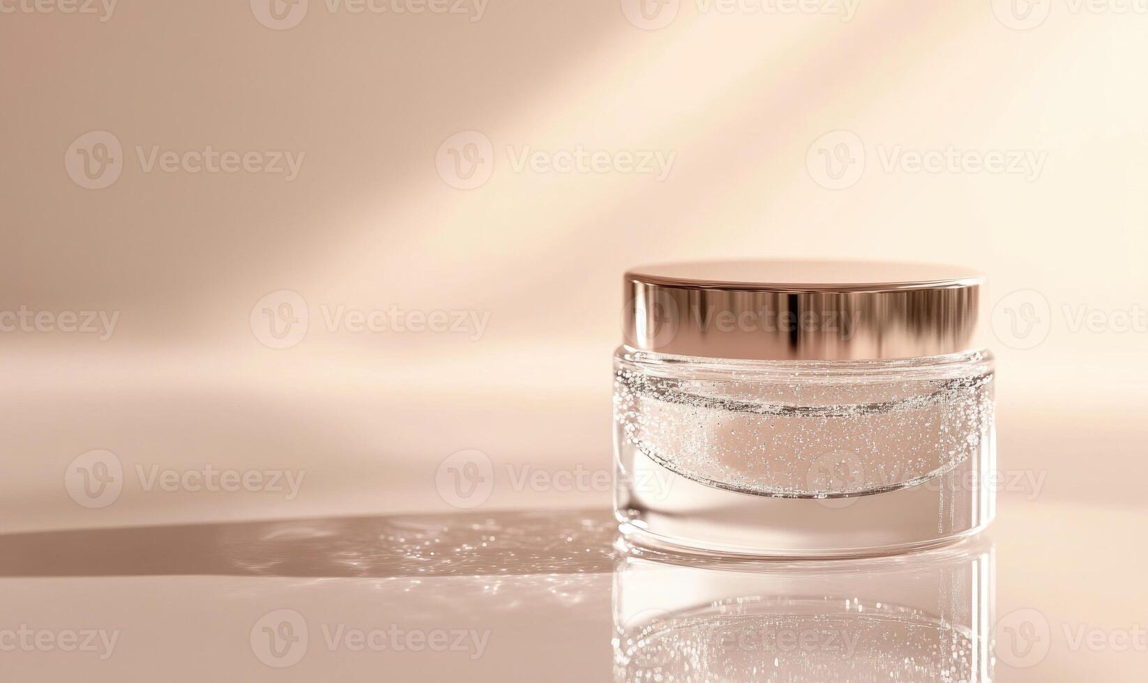 A clear jar with a gold lid photo