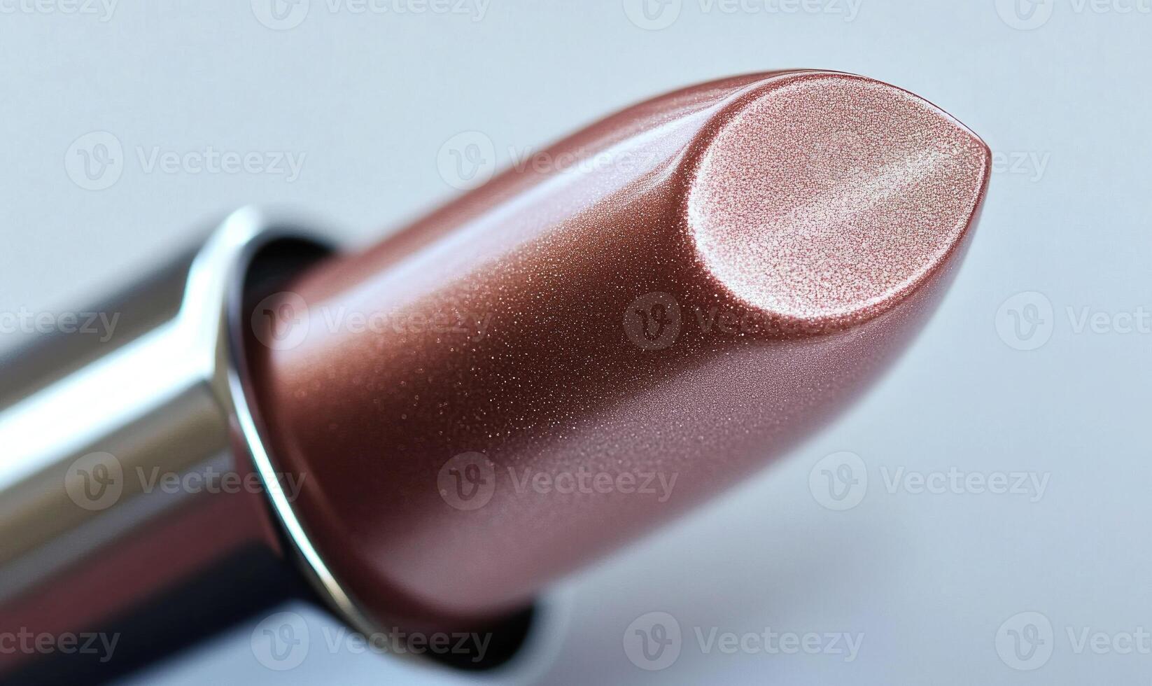 A close up of a lipstick with a shiny, metallic finish photo