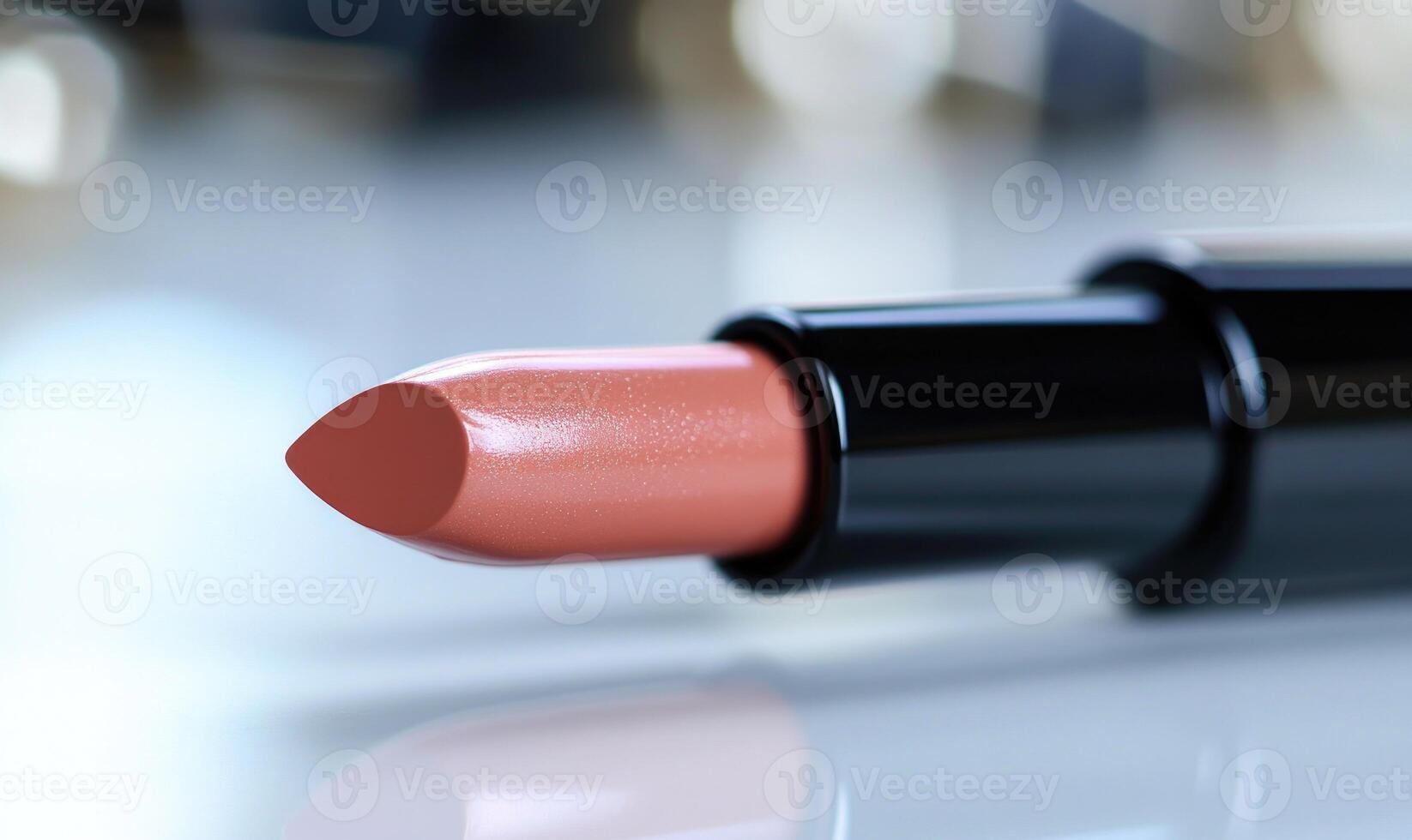 A lipstick is shown with a black cap photo