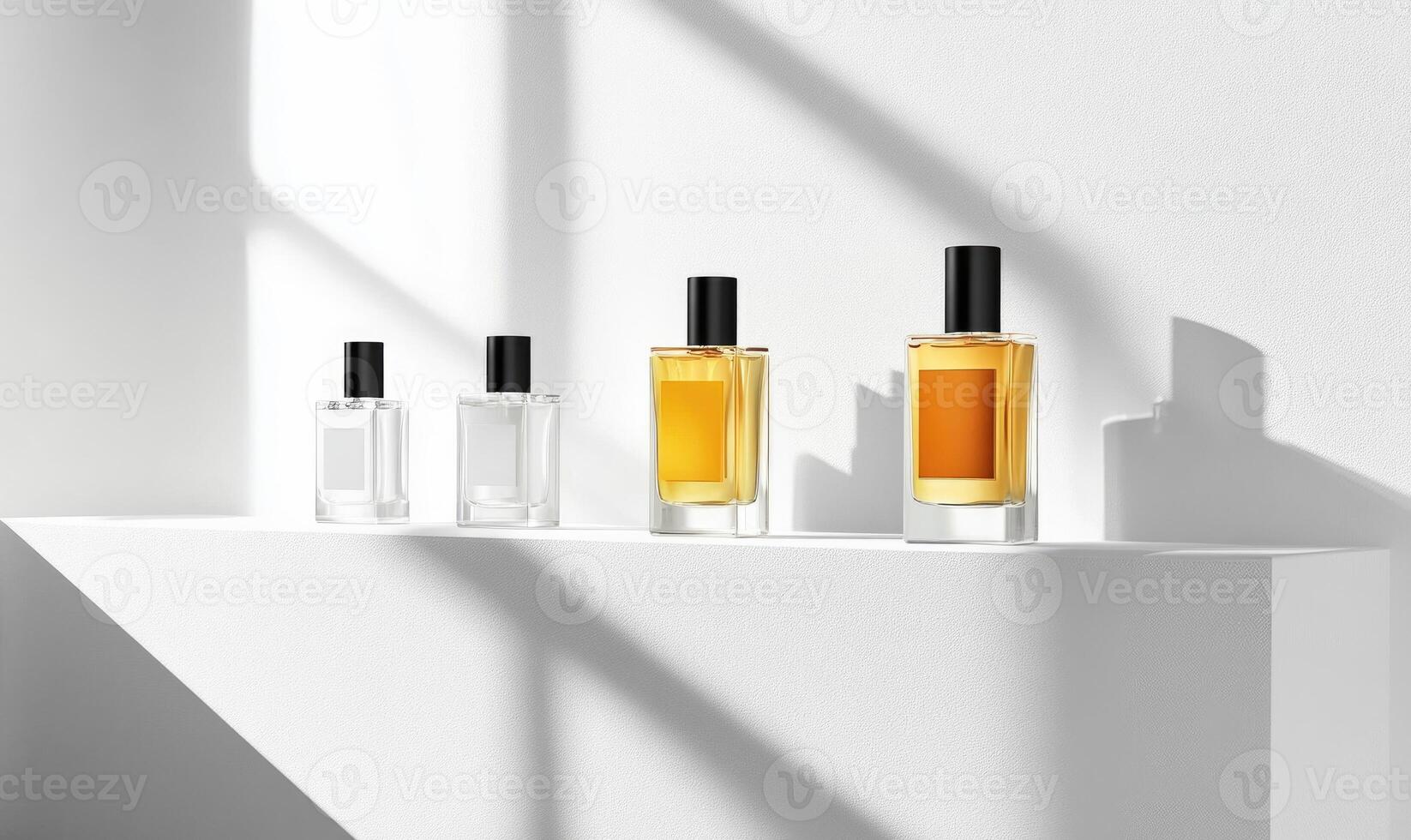 Four bottles of perfume are lined up on a shelf photo