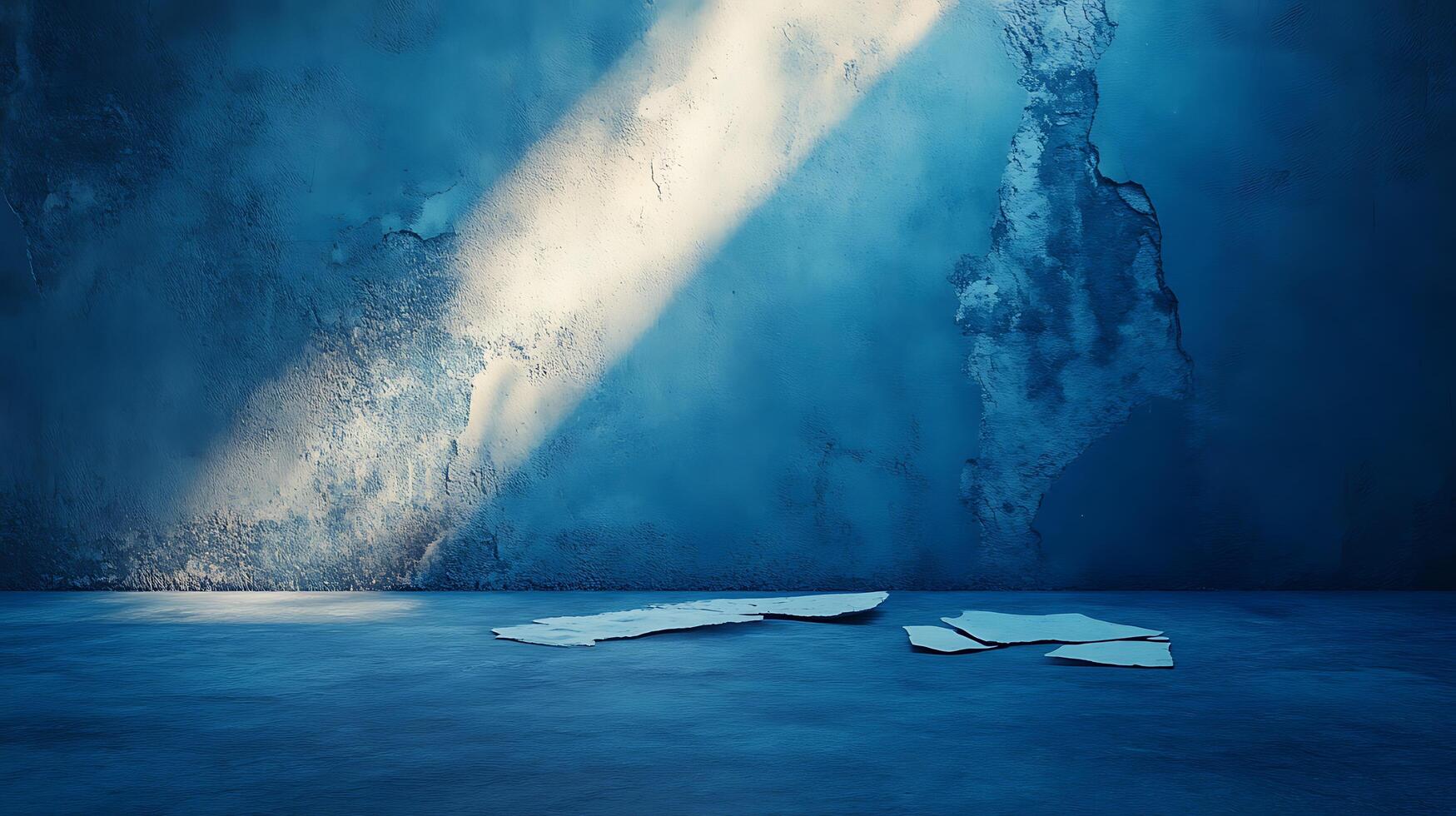 Abstract studio featuring a damaged textured wall, bathed in a cool blue tone and illuminated by a beam of bright white light. photo