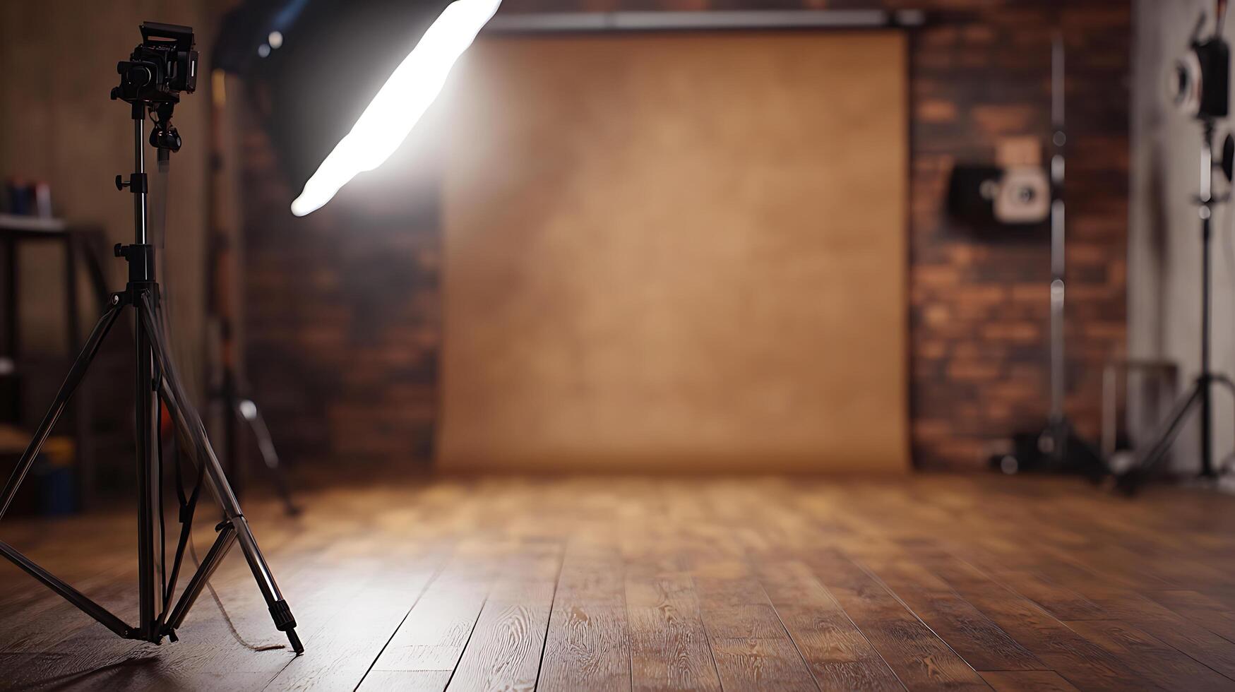 Photography studio with lighting and backdrop. The wooden floor and brick wall provide a rustic background for a photo shoot.