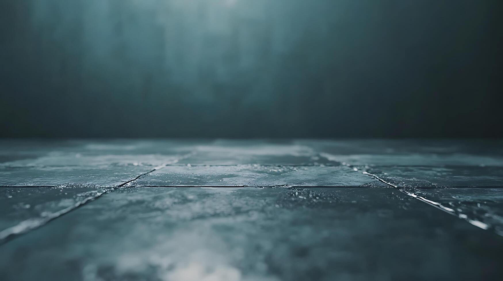 A surface made up of square tiles with light blue and gray gradients. There is a dark gray background that fades upwards in color. photo