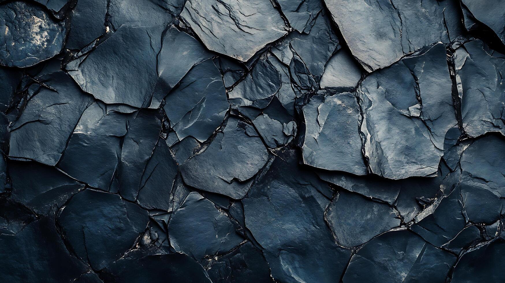 Close-up shot of jagged, dark-colored rock formations in a natural setting, showcasing textures and geological patterns. photo