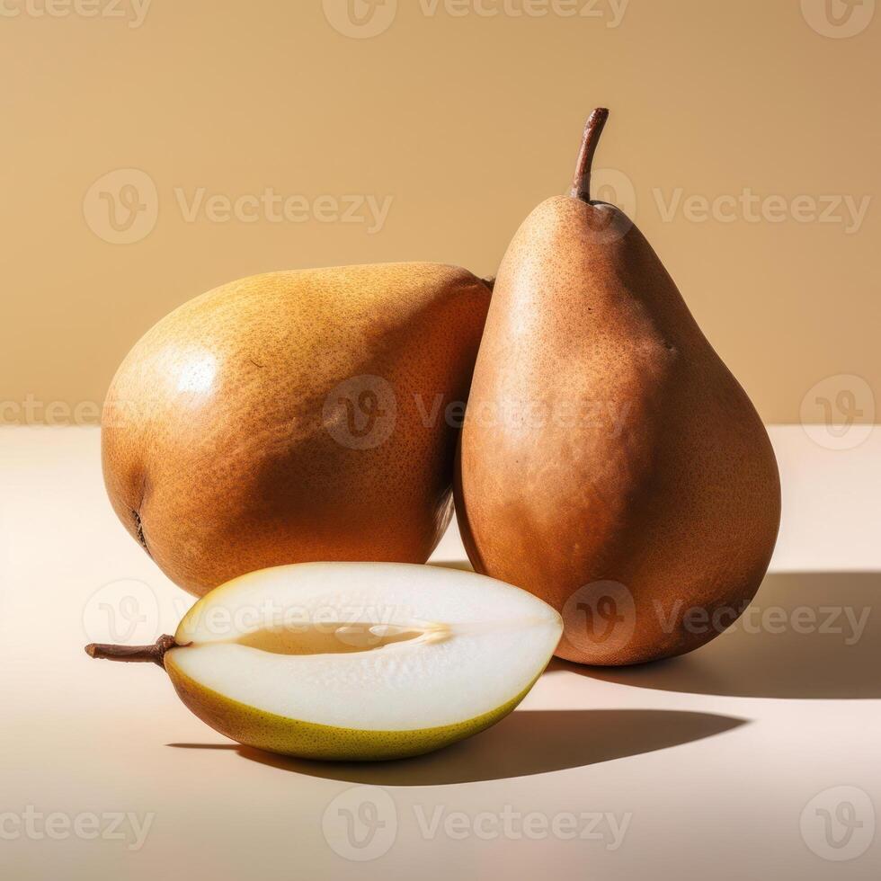 Two pears and a slice of pear photo