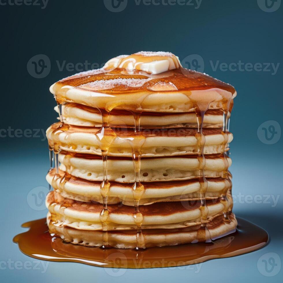 stack of pancakes with syrup and butter photo