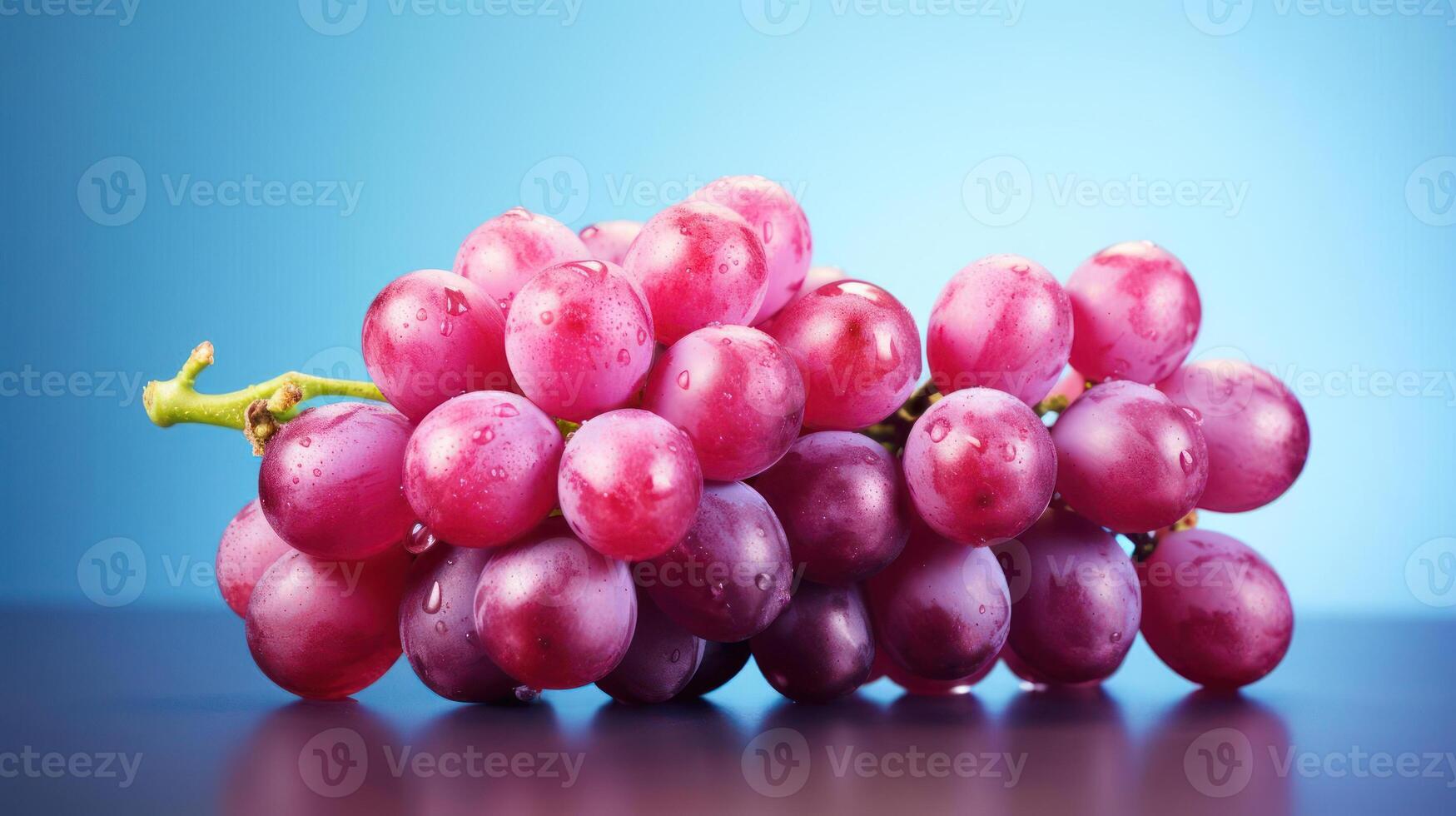 Cluster of purple grapes with water droplets on them. photo