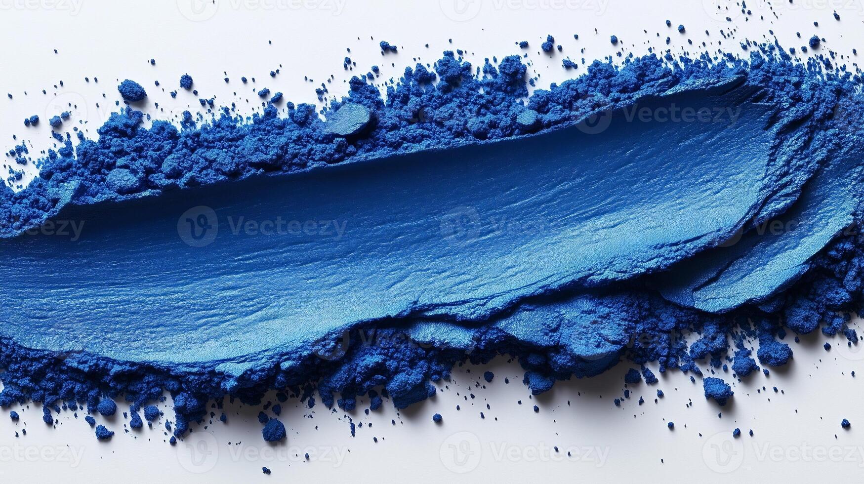 Vibrant Cobalt Blue Powder Spread on Bright White photo