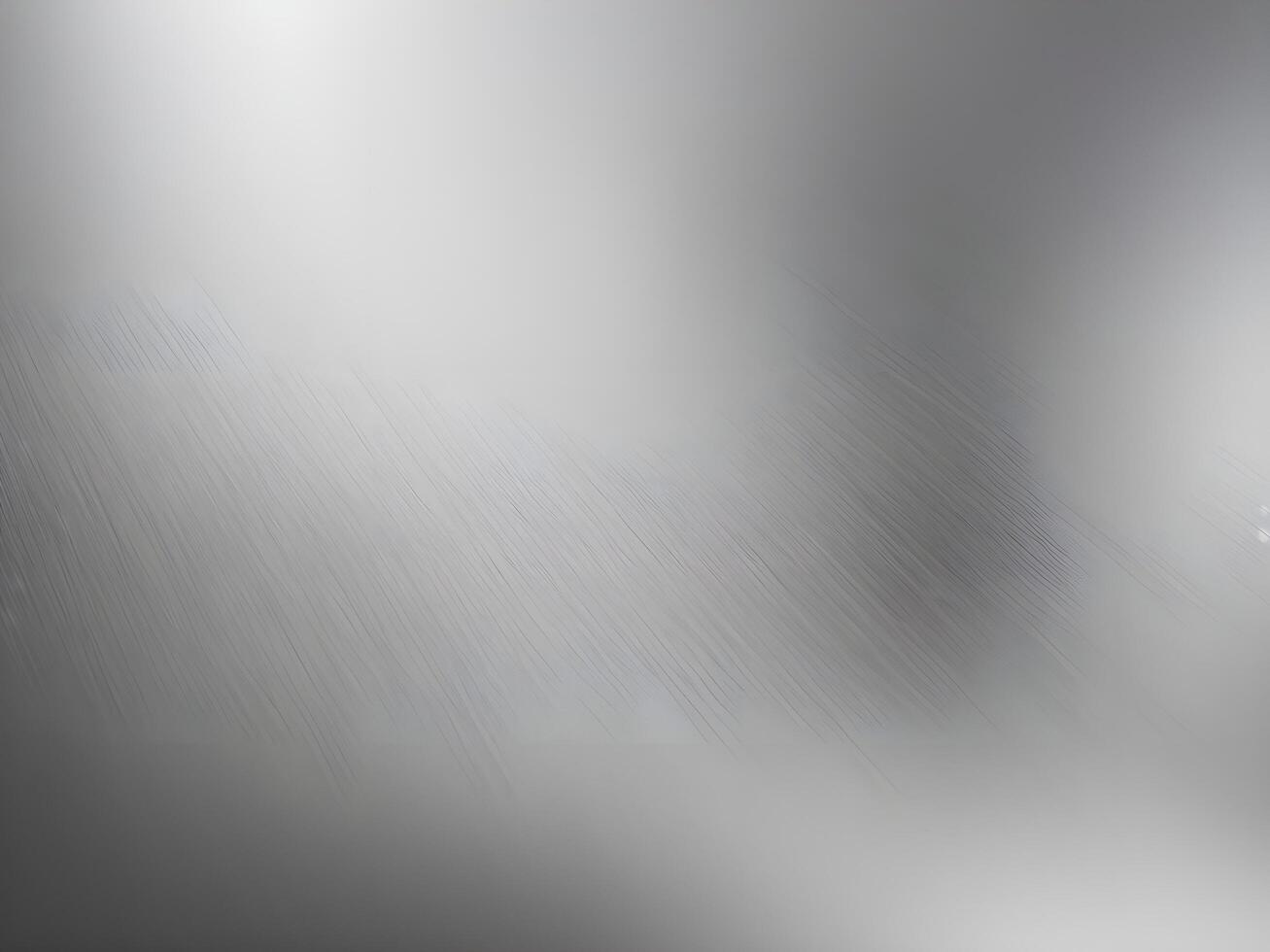 A high-resolution close-up of polished steel with subtle brushed patterns. photo