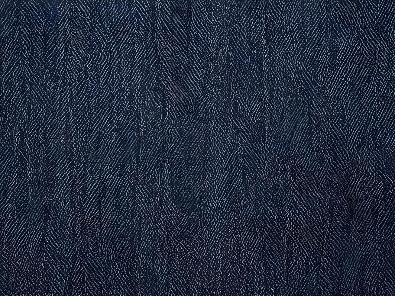 A high-resolution close-up of classic blue denim fabric with visible weave. photo