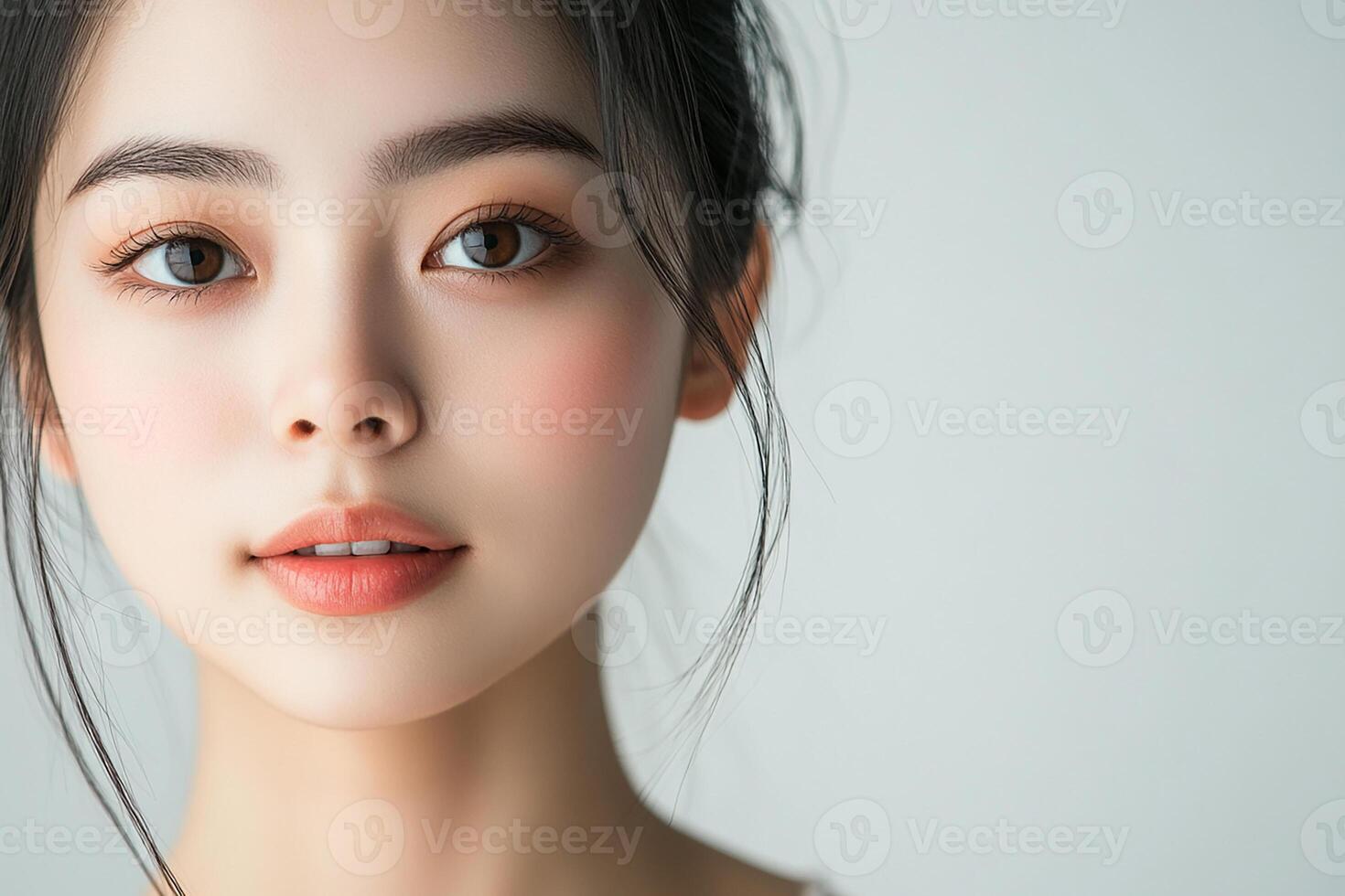 A beautiful young woman with long hair and a pink eye photo