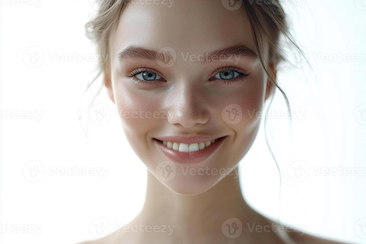 A woman with blue eyes is smiling photo