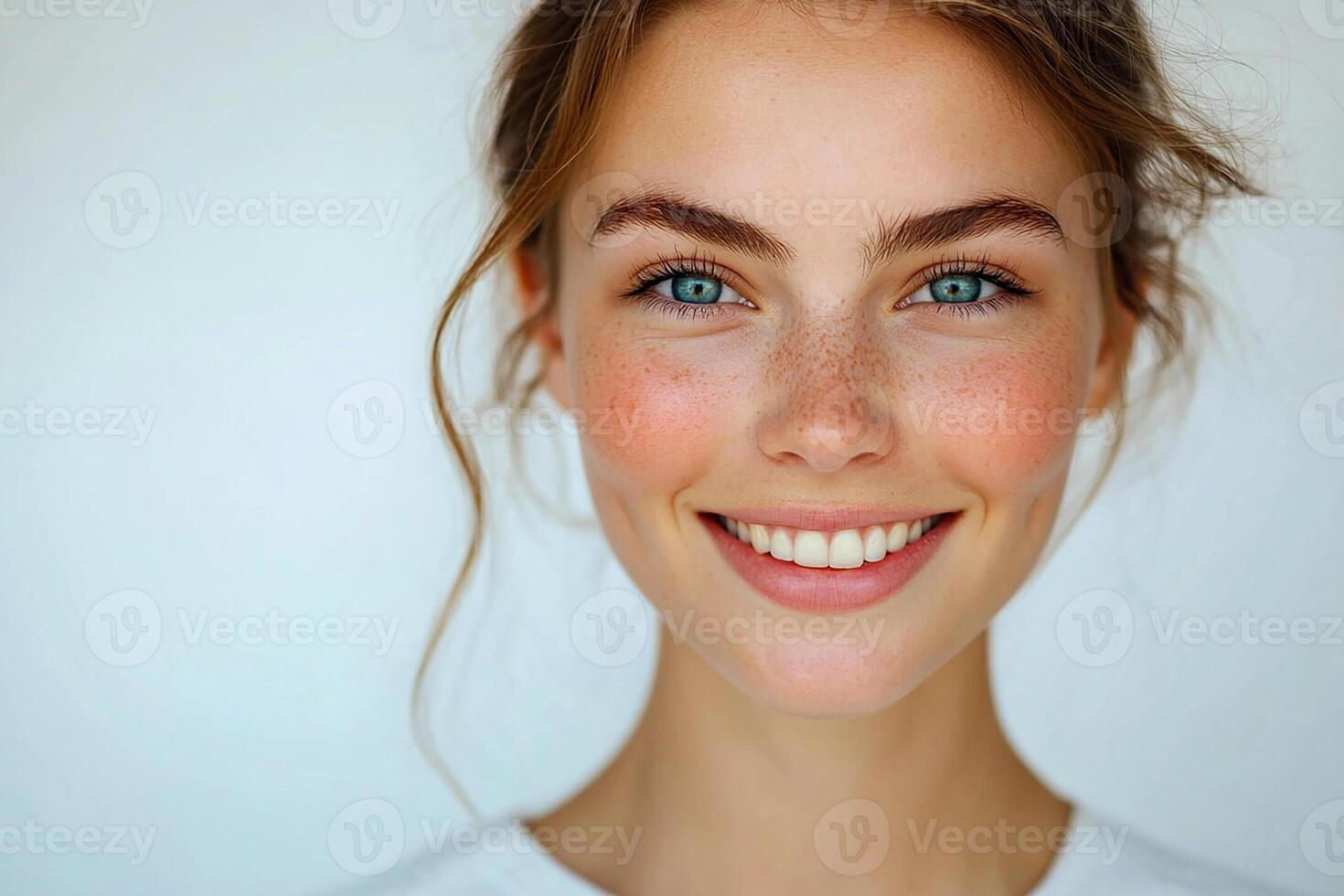 A woman with freckles on her face photo