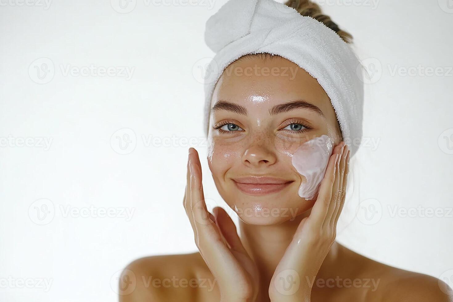 A woman with a towel on her head and a face mask photo
