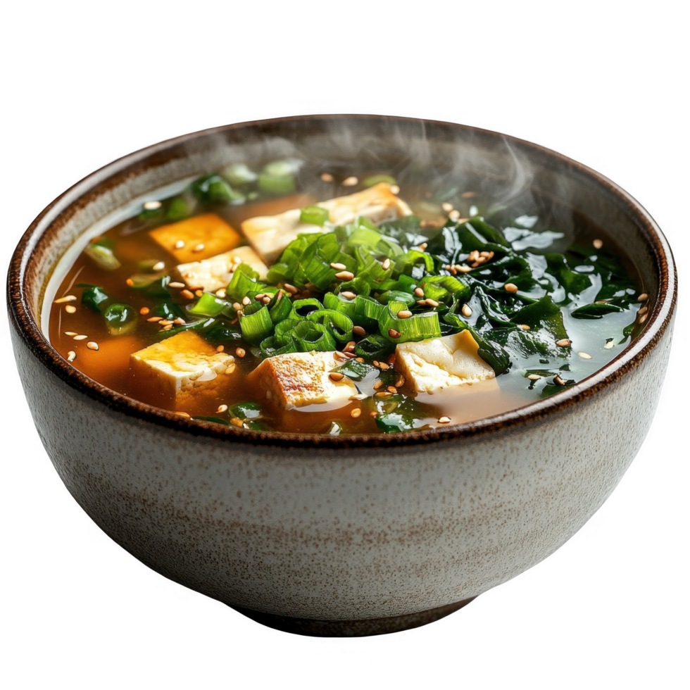 A bowl of soup with tofu and greens png