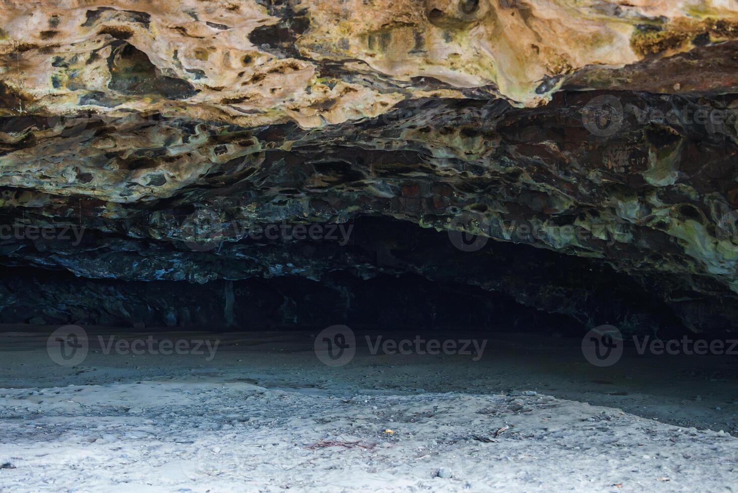 Entrance to a Coastal Cave with Textured Rock Ceiling in Hawaii photo