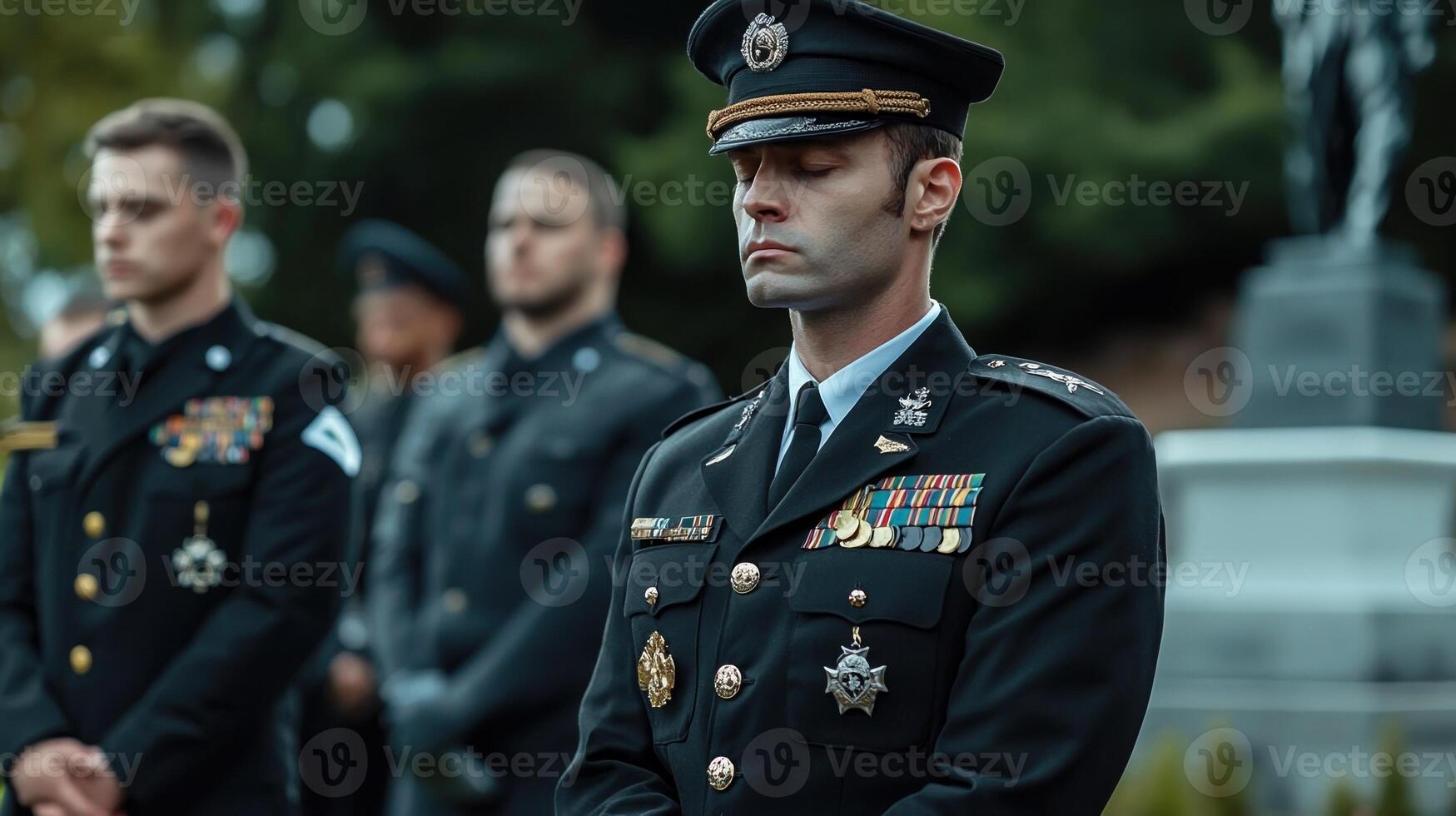 A man in uniform stands in front of other men photo