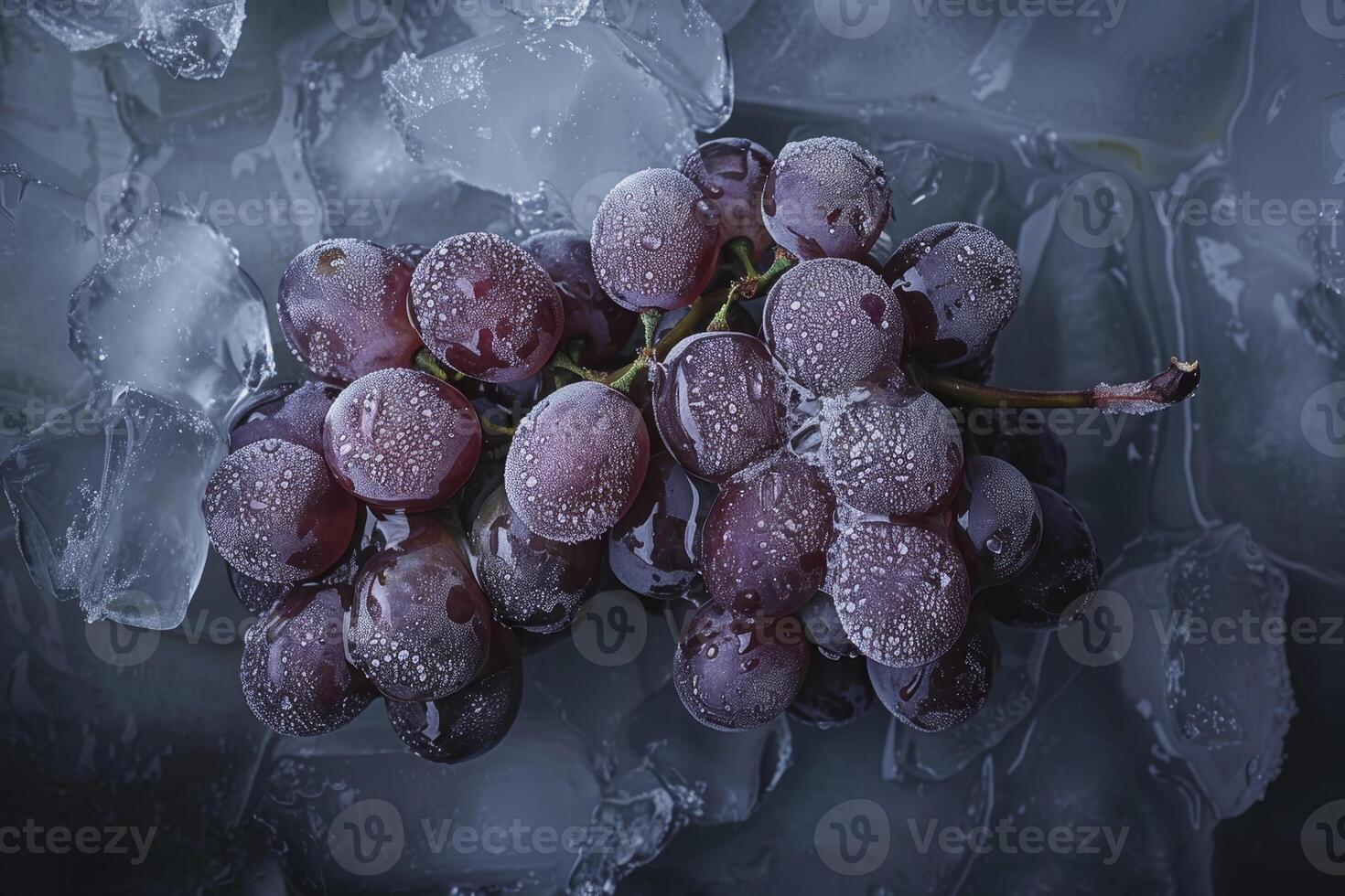 A bunch of grapes sitting on ice photo
