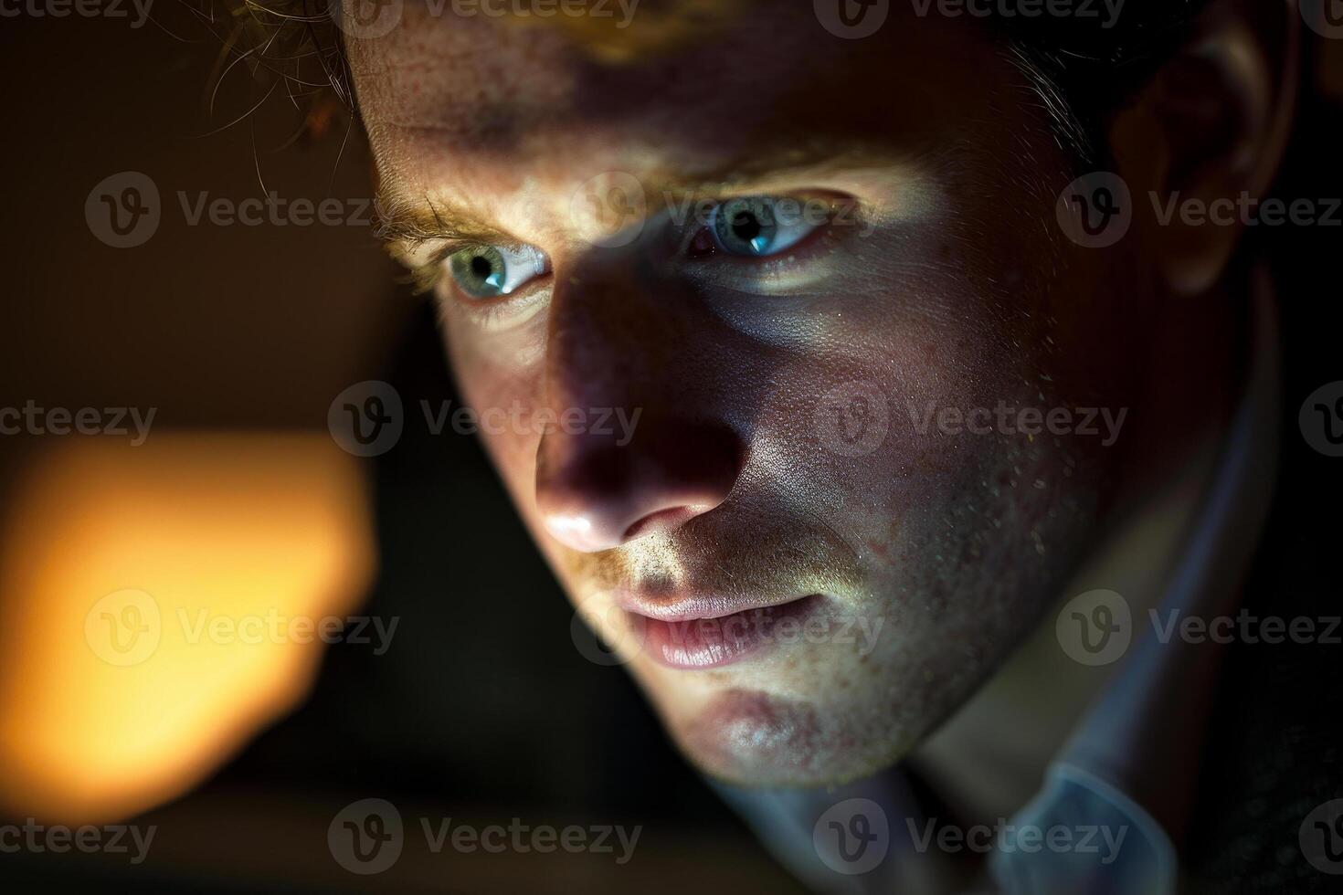 A man looking at a computer screen photo