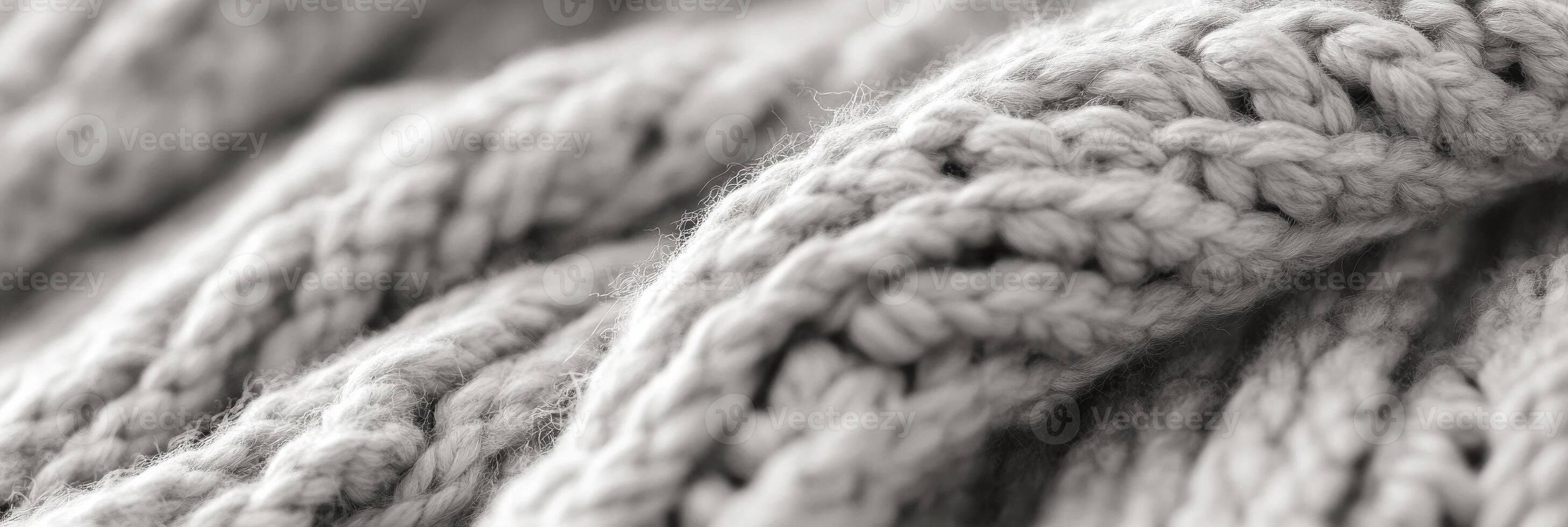Close-up of soft woolen knitted fabric texture in neutral gray shades photo