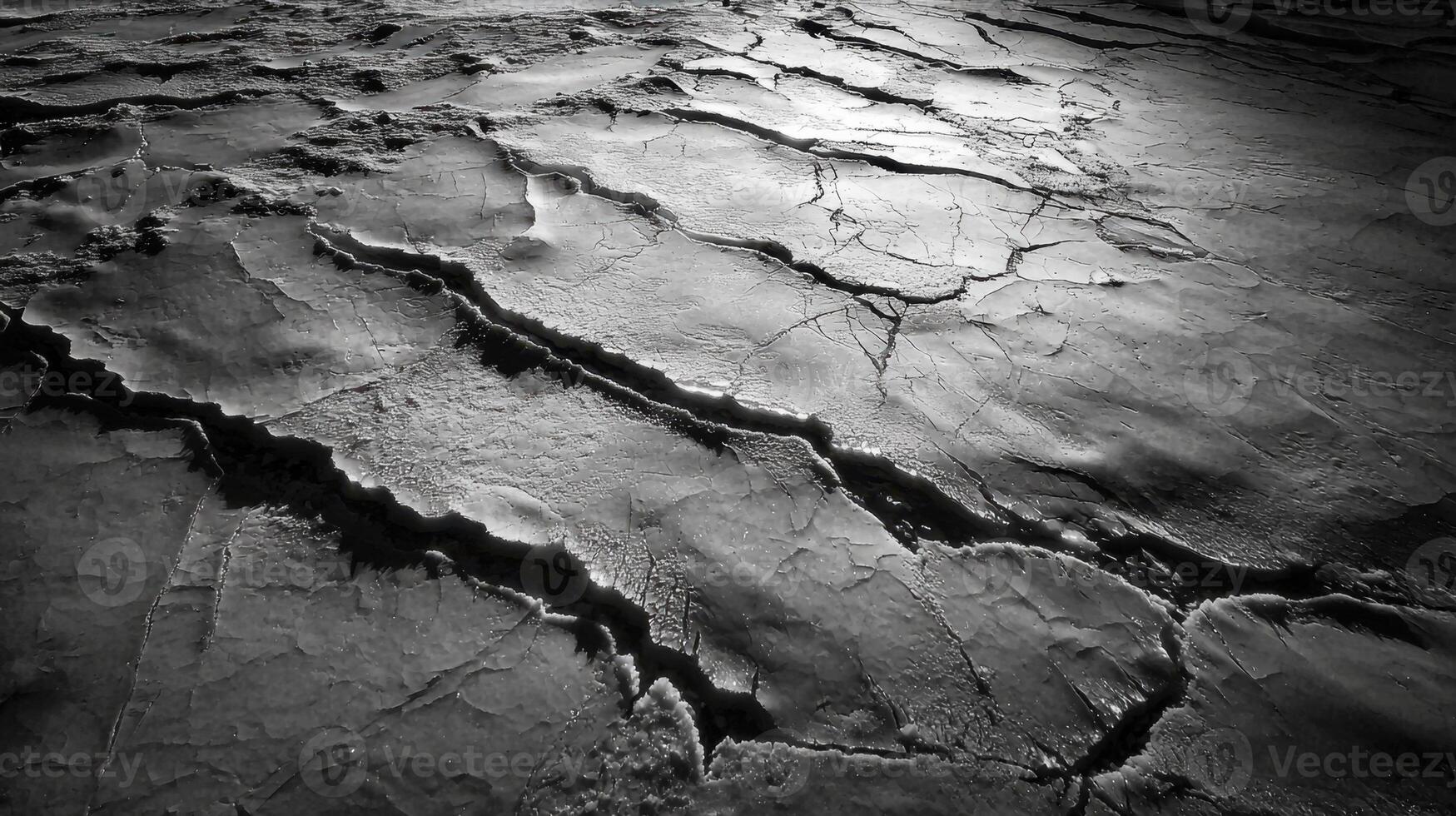 Cracks in the surface of a black and white photo