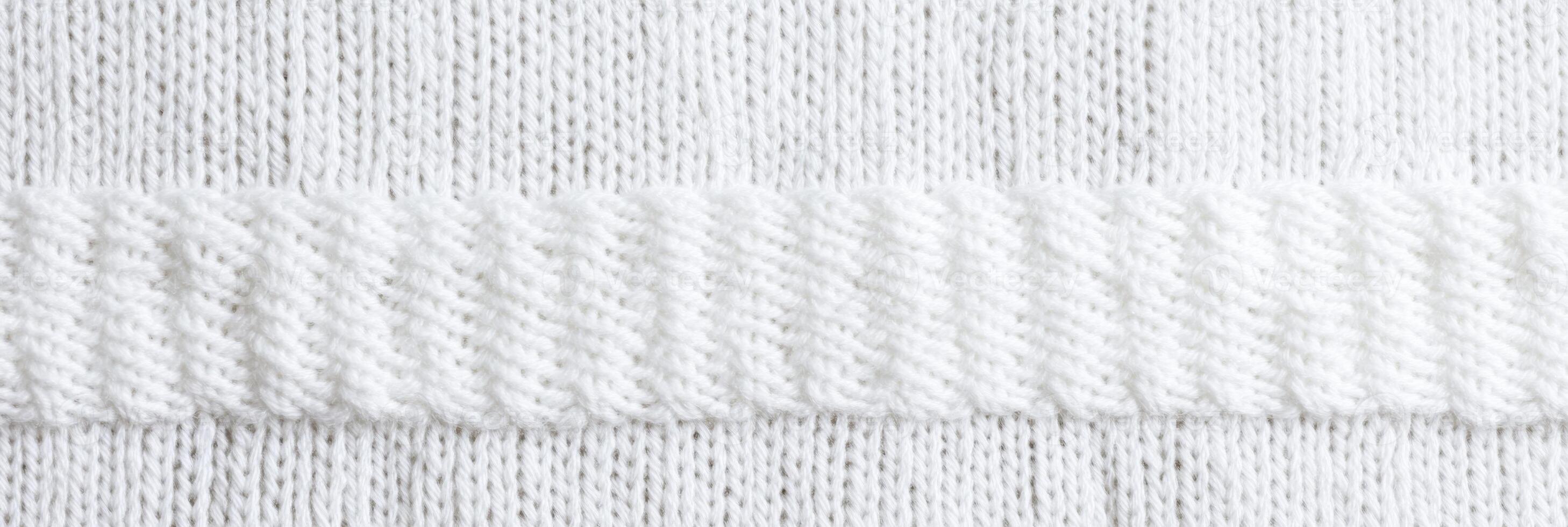 Close-up of white knitted fabric texture with horizontal ribbing pattern photo