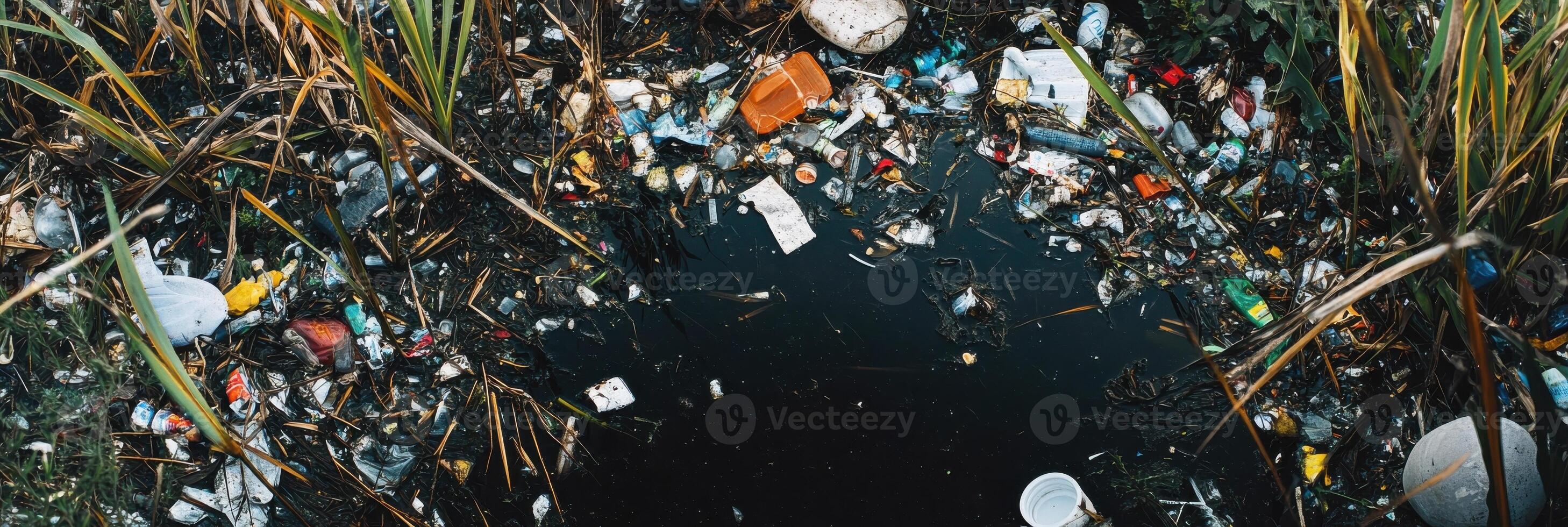 Environmental crisis highlighted by garbage and pollution in natural setting photo
