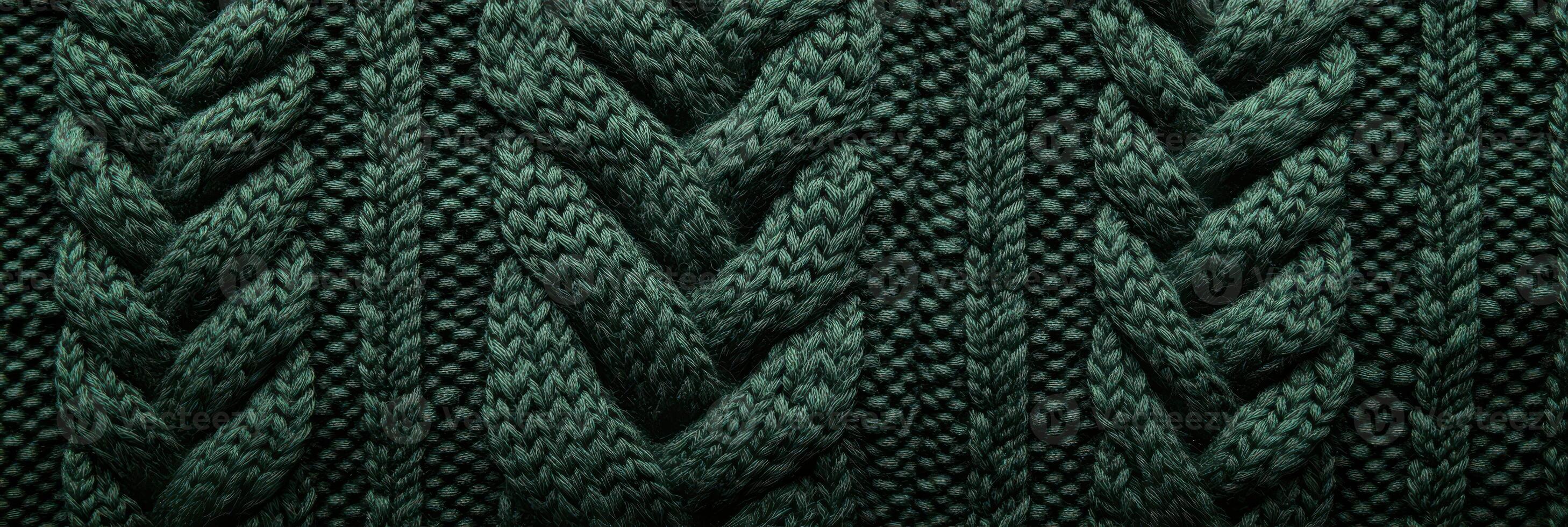 Close-up of green knitted wool fabric showcasing intricate patterns and textures photo