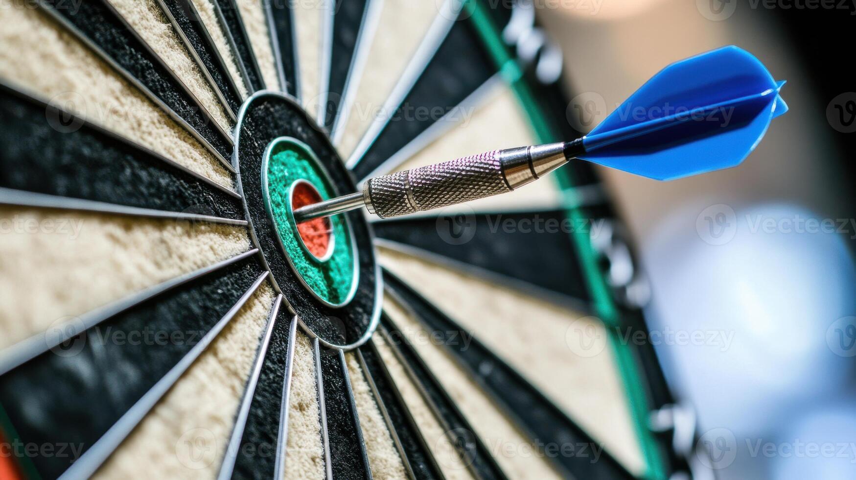Close-up of a dart hitting the bullseye on a dartboard in a game concept photo